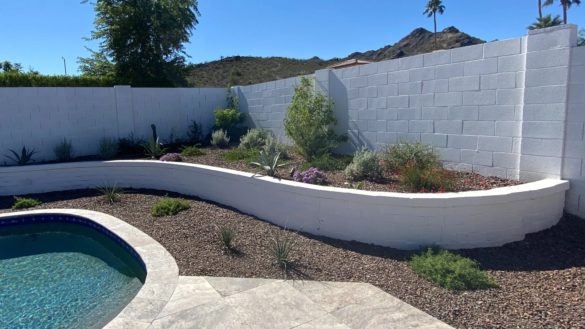 How Are Retaining Walls Beneficial for Sloped Yards?